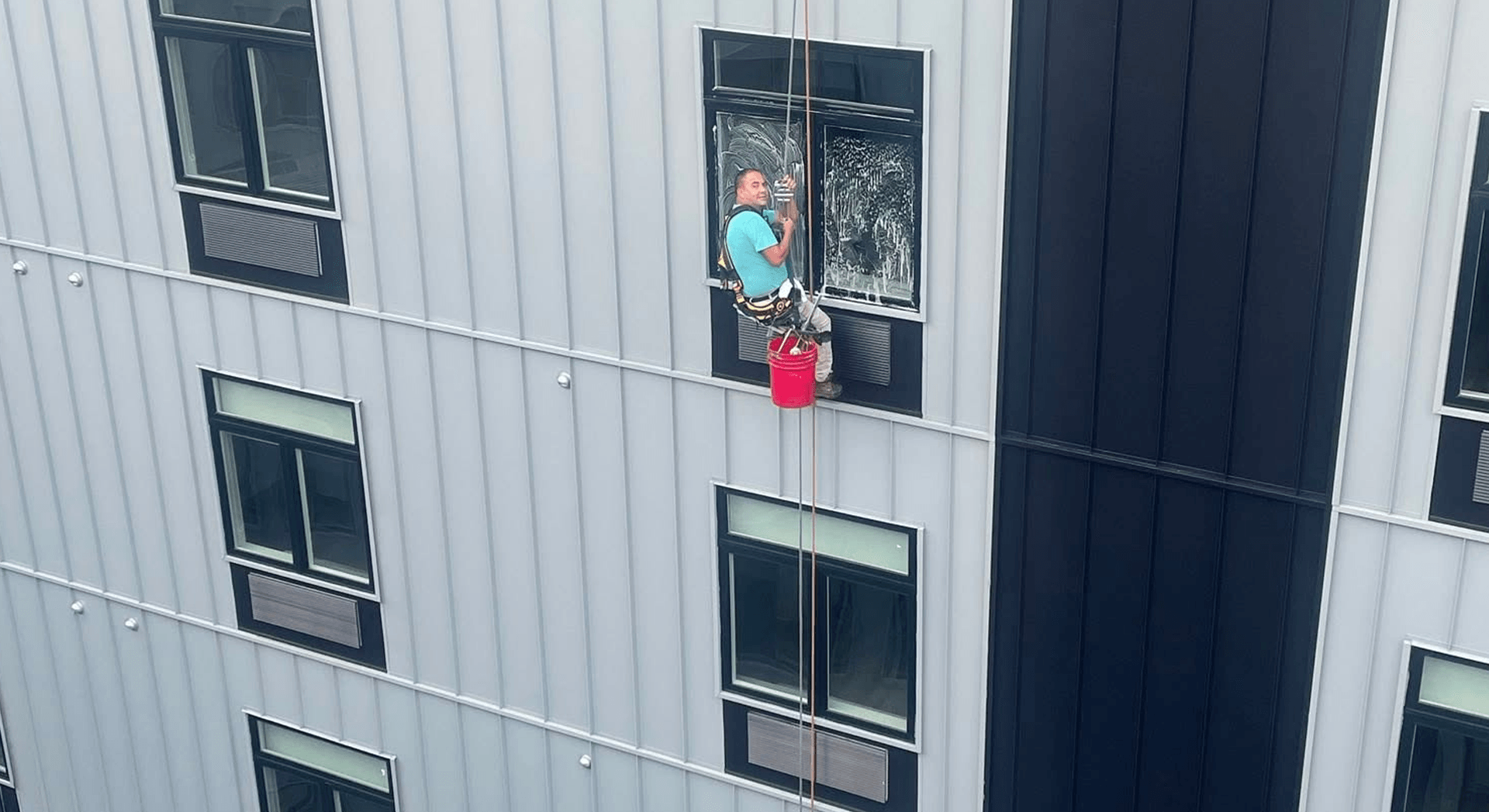 Professional window cleaning technician at work — Founding Members Community research